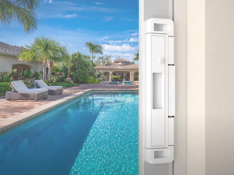 Double bolt lock on a sliding glass door providing burglary protection and childproofing from the pool area beyond